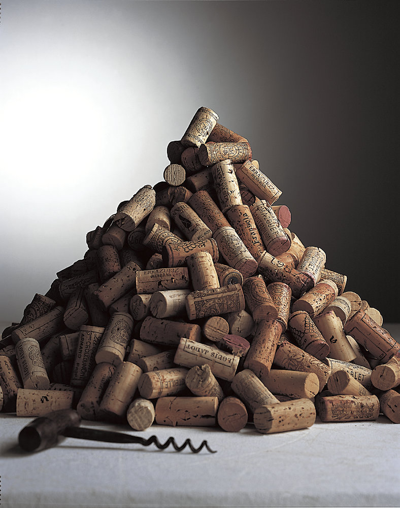 Pyramid pile of corks – Photograph by George Ong