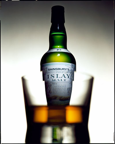 Sainsburys Islay malt whisky bottle and glass – Photograph by George Ong