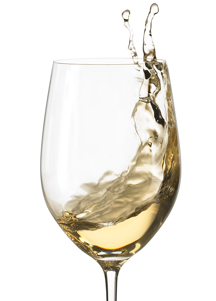 White wine splashing in glass – Photograph by George Ong