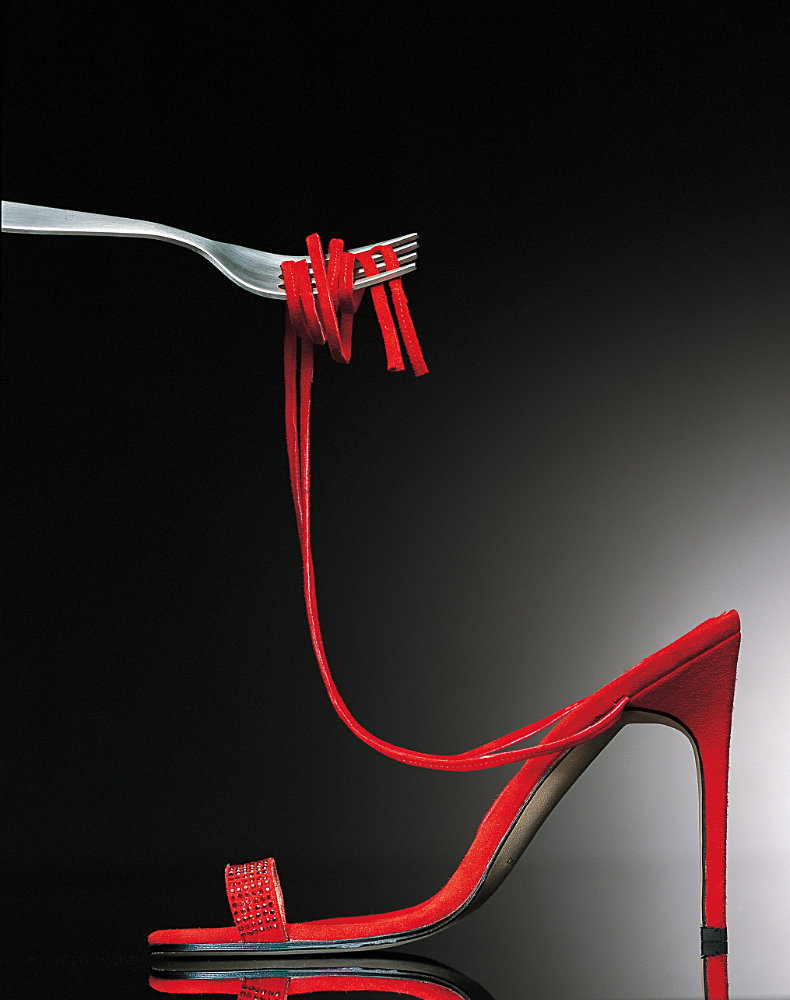 Red shoe with fork holding straps like spaghetti – Photograph by George Ong