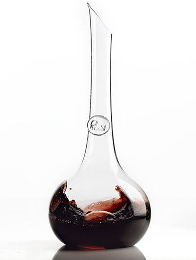 Close up of red wine swirled in carafe – Photograph by George Ong