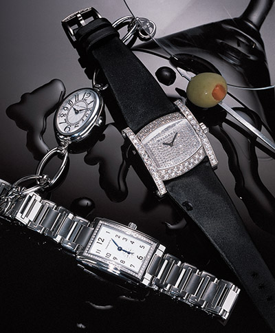 Watches, cocktail glass and olive – Photograph by George Ong