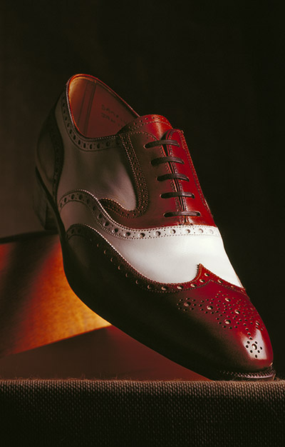Tan and white brogue shoe – Photograph by George Ong