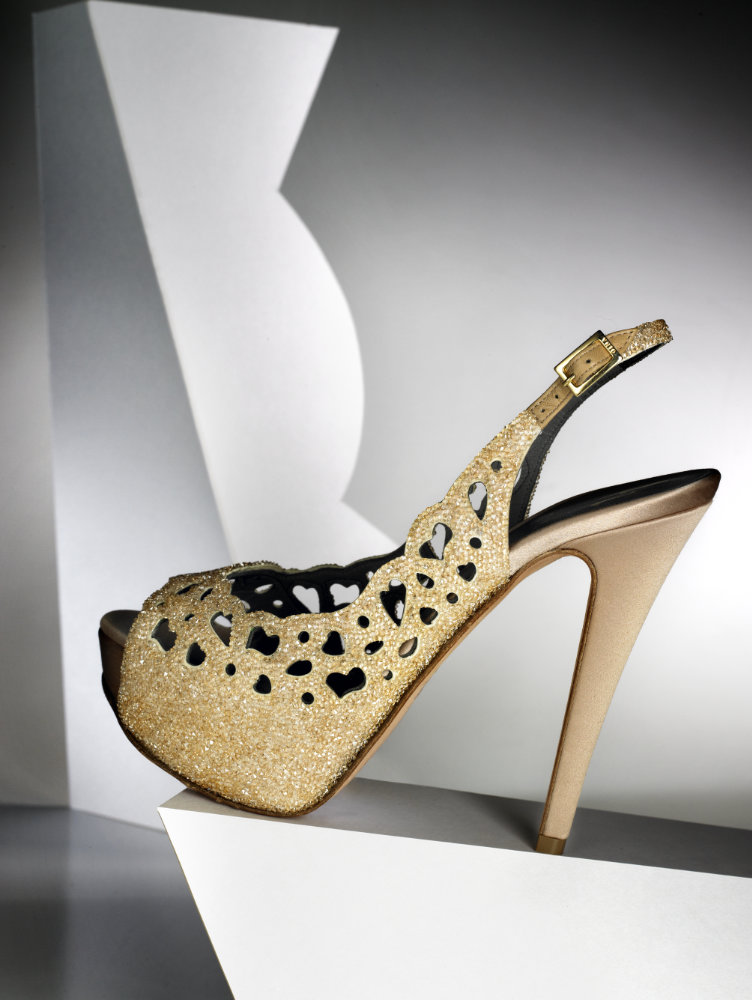 Ladies gold glitter shoe – Photograph by George Ong