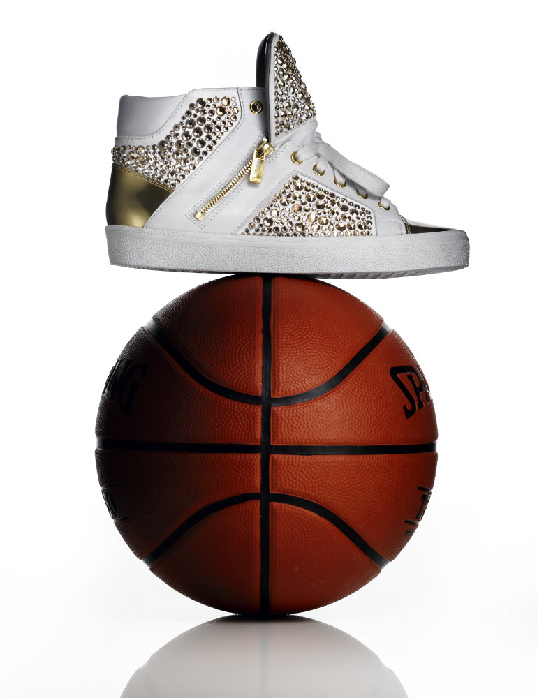 Diamond encrusted trainer on top of basketball – Photograph by George Ong