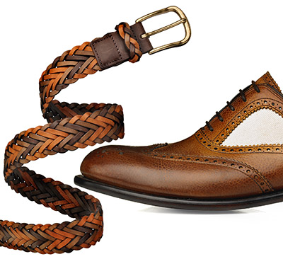 Mens tan and white brogue shoe with leather belt – Photograph by George Ong