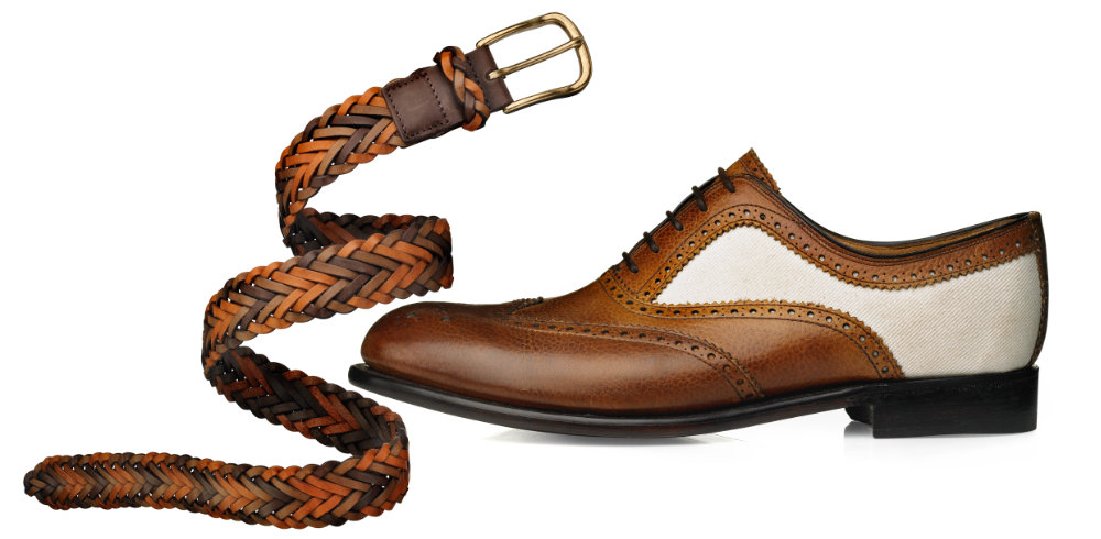 Mens tan and white brogue shoe with leather belt – Photograph by George Ong