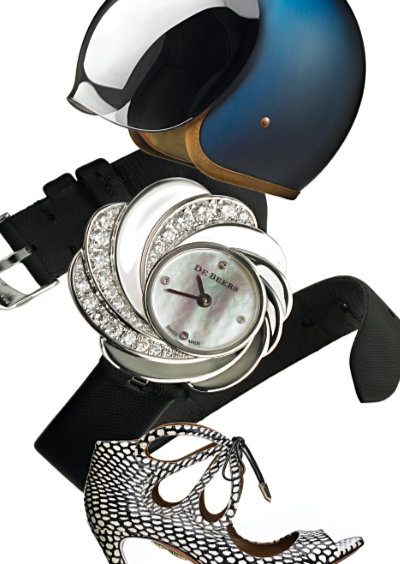 composition with crash helmet, black leather belt, diamond watch and high heeled shoe – Photograph by George Ong